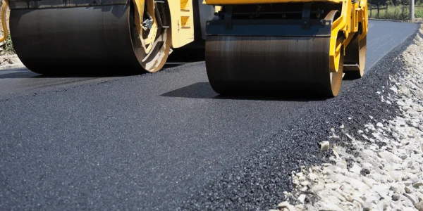 Professional asphalt resurfacing being done on a Tampa driveway by Florida Asphalt Solutions